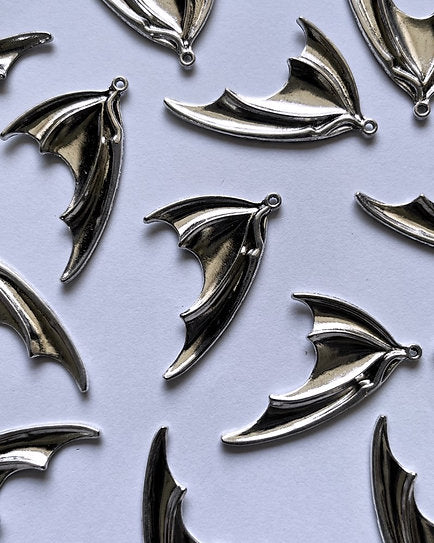 Devil Feather Charm