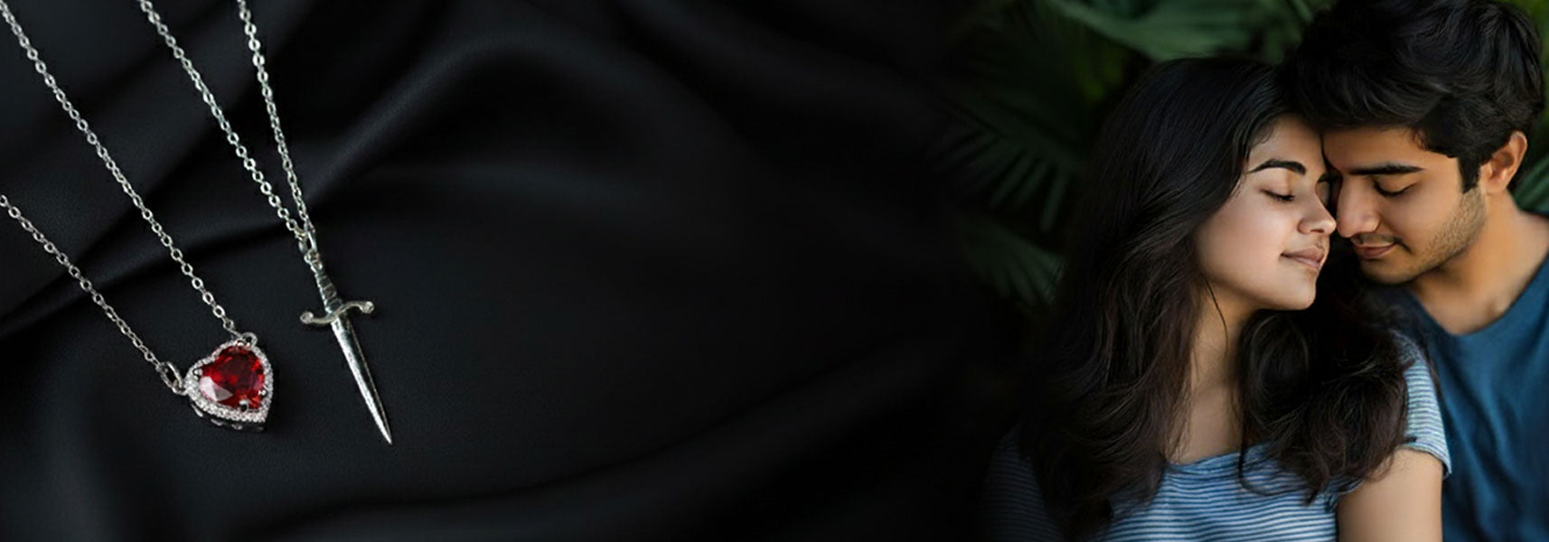 Necklace with a heart-shaped red gemstone pendant on a black background, with a couple embracing in the background.